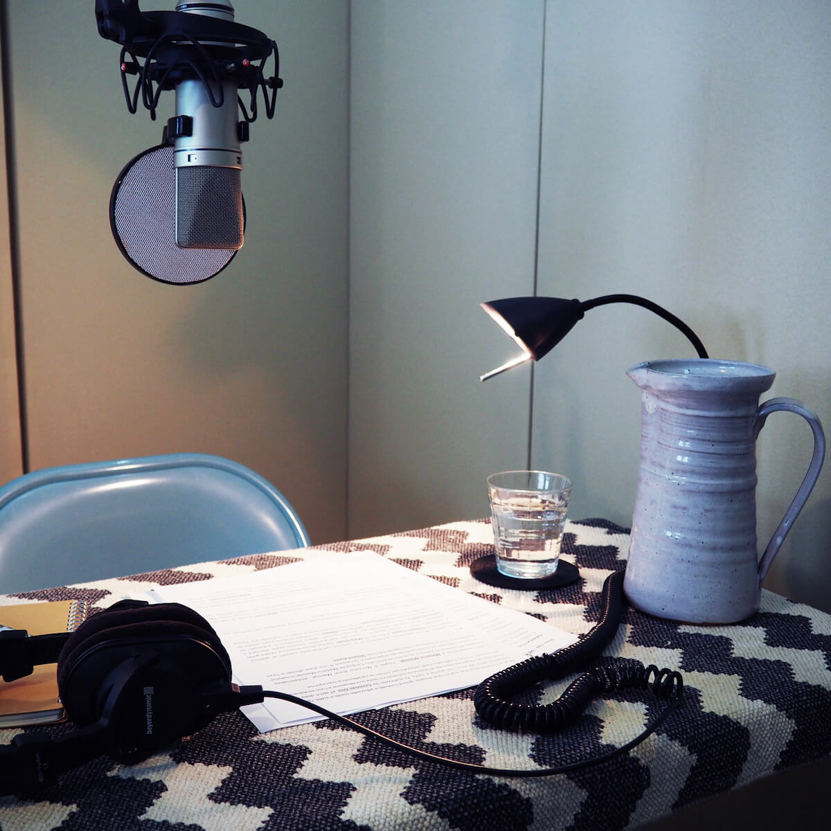 A microphone and desk inside our podcast studio space